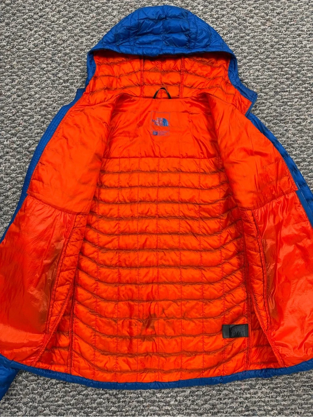 The North Face Men's Blue Packable Puffer Jacket with Orange Hood